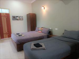Кровать или кровати в номере Kanvas Suites - Sun N Moon