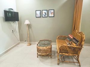 Телевизор и/или развлекательный центр в Kanvas Suites - Sun N Moon