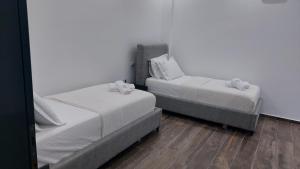 Postel nebo postele na pokoji v ubytování Bujtina Xhabakja