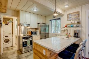 a kitchen with a counter and a stove top oven at Truly Tahoe in Homewood