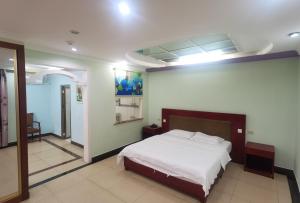 Tempat tidur dalam kamar di Sunshine Garden