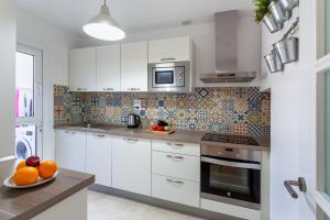 Kuchyň nebo kuchyňský kout v ubytování Zen Home Tauro