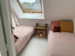 Posteľ alebo postele v izbe v ubytovaní adorable appartement à deux pas de la plage