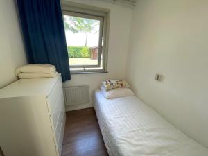 Postel nebo postele na pokoji v ubytování Vakantiebungalow Deltona