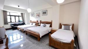 Postel nebo postele na pokoji v ubytování Fish House Homestay