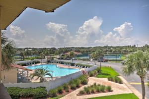 an aerial view of a swimming pool at a resort at Colorful Oceanside Condo with Beach Access! in Saint Augustine Beach