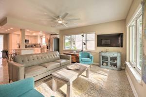 a living room with a couch and a table at Pet-Friendly Waterfront Home - 2 Mi to Beach! in Tarpon Springs