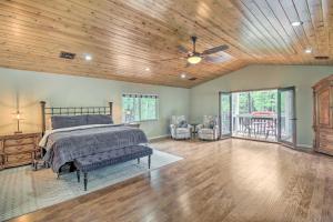 a bedroom with a bed and a wooden ceiling at Cozy Pinetop Retreat with Yard and Heated Gazebo! in Indian Pine