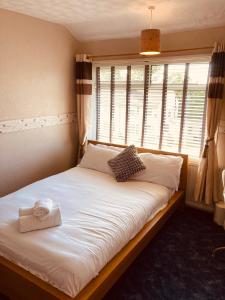 Postel nebo postele na pokoji v ubytování 'Melrose' at stayBOOM