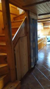 a kitchen with a staircase in a house at Villa Nina in Kramolin in Kramolin