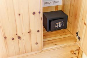 a small stove in the corner of a tiny house at Hotel San Rocco in Livigno