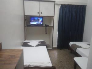 Hotel Kartiki客房内的一张或多张床位