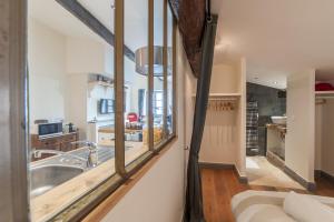 a kitchen with a sink and a large mirror at La Maison Debourg in Lyon +77 photos