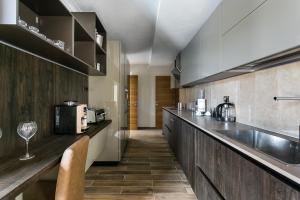 a kitchen with a sink and a counter top at Villa Semiramis in Tivat