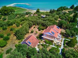 an aerial view of a house on a beach at Maria's Paradise in Astrakeri