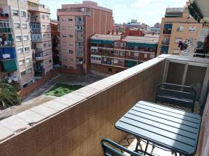 a bench sitting on the ledge of a balcony at COOL! 5' to metro. 15' to Center/beach by metro. in Santa Coloma de Gramanet