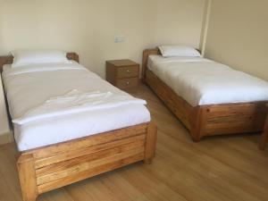 Katil atau katil-katil dalam bilik di Beli Guest House