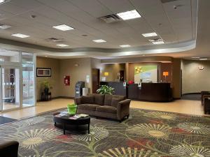 a lobby with a couch and a coffee table at Wyndham Garden Dover in Dover
