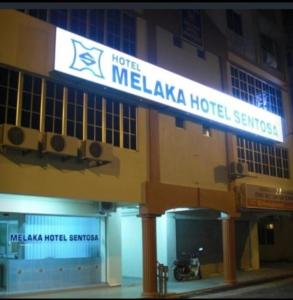 a hotel with a sign that reads melaka hospital at MELAKA HOTEL SENTOSA in Melaka