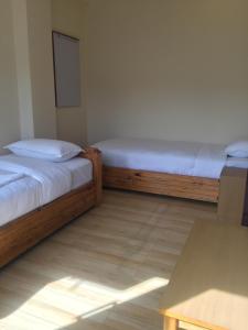 Katil atau katil-katil dalam bilik di Beli Guest House