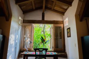 a room with a table and chairs and a window at Casa Real Del Cabrero by Soho in Cartagena de Indias
