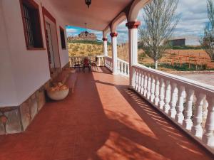 a porch of a house with a view of a field at Casa rural cascales 