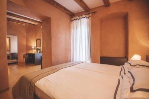 Posteľ alebo postele v izbe v ubytovaní Heritage Hotel Kukuriku