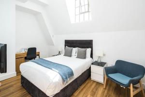 Postel nebo postele na pokoji v ubytování Equitable Hotel