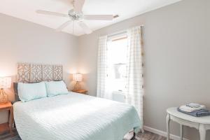 a bedroom with a bed and a ceiling fan at Spacious ranch minutes to Stone Harbor in the heart of downtown in Cape May Court House