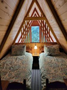 Letto o letti in una camera di Cabin In The Woods