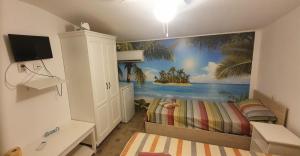 a bedroom with a mural of a beach at Cazare Muncitori Mangalia-2 Mai in 2 Mai