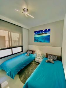 Postel nebo postele na pokoji v ubytování Royal Beach 607