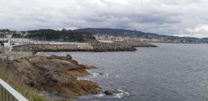 a view of a body of water with a beach at Apartamento Alba in Portonovo +2 photos