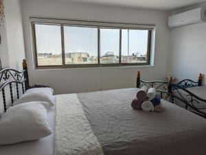 a bedroom with a bed with towels on it at New Citadel Hostel in Jerusalem
