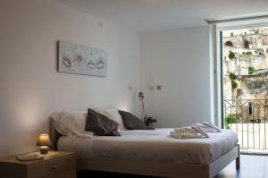 Postel nebo postele na pokoji v ubytování La Scala Suite