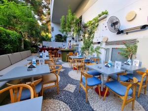 an empty restaurant with tables and chairs at New President Hotel Cairo in Cairo