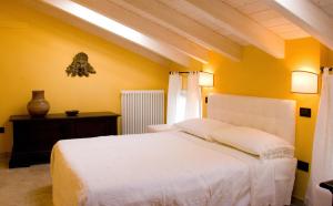 Säng eller sängar i ett rum på B&B A Casa Dell'Antiquario