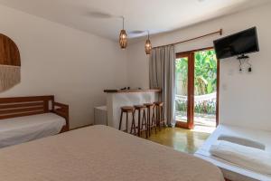 Ένα ή περισσότερα κρεβάτια σε δωμάτιο στο Casa Luar Trancoso +52 φωτογραφίες