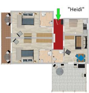 a floor plan of a house with a green arrow at Ferienwohnungen am Schlossberg Oberstaufen in Oberstaufen