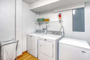 a white laundry room with a washer and dryer at Daily 75 in Avon +37 photos