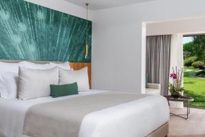Postel nebo postele na pokoji v ubytování Dreams Flora Resort & Spa - All Inclusive
