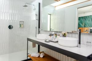 A bathroom at Dreams Flora Punta Cana Resort & Spa