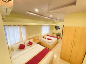 Prabhuvihar Residency客房内的一张或多张床位