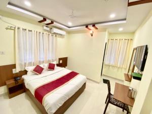 Prabhuvihar Residency客房内的一张或多张床位