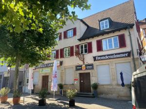 a building with a sign on the front of it at Gasthaus Lamm in Waldenbuch