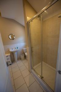 a bathroom with a shower and a sink at The Larches in Bewdley