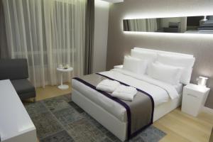 Ein Bett oder Betten in einem Zimmer der Unterkunft The Leos Residence