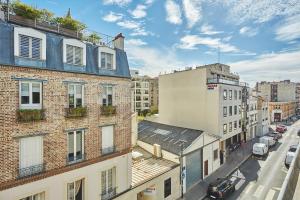 an overhead view of a city street with buildings at Residence Boulogne Centre le passage by Studio prestige in Boulogne-Billancourt