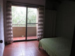 Ένα ή περισσότερα κρεβάτια σε δωμάτιο στο Casas Miraverde