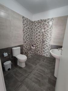 Koupelna v ubytování kaite house